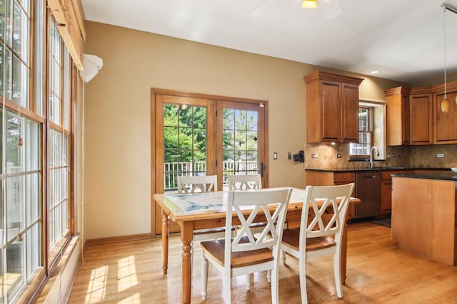 1560 Fairway Cir, Geneva, IL 60134 - dining room featuring light wood finished floors, a ceiling fan, and healthy amount of natural light