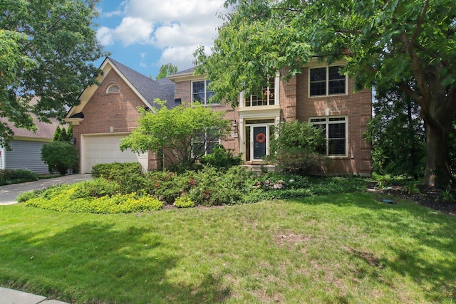 1560 Fairway Cir, Geneva, IL 60134 - traditional home with brick siding, a front yard, an attached garage, and driveway