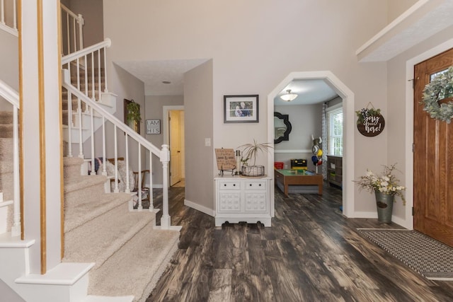 1608 Surrey St, Normal, IL 61761 - foyer entrance featuring wood finished floors, stairway, and arched walkways