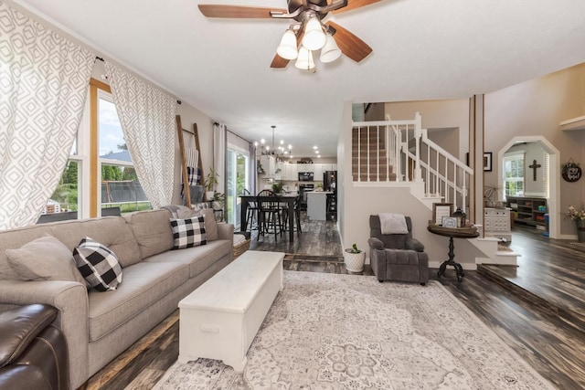 1608 Surrey St, Normal, IL 61761 - living area with wood finished floors, stairs, a ceiling fan, arched walkways, and a chandelier