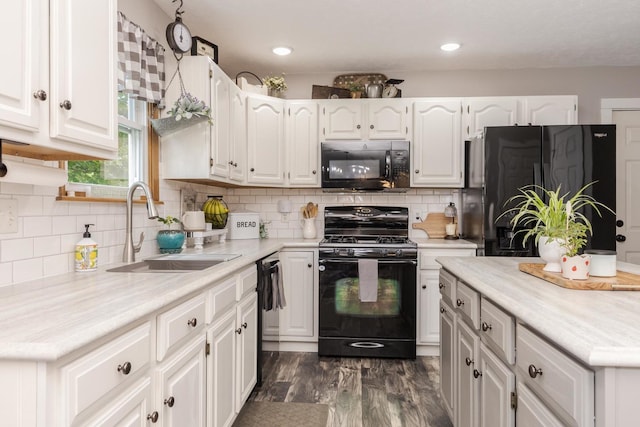 1608 Surrey St, Normal, IL 61761 - kitchen with black appliances, white cabinetry, and light countertops