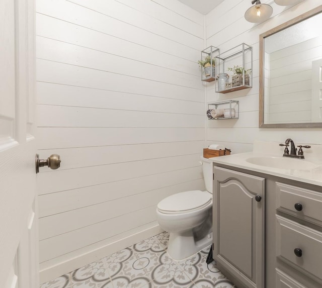 1608 Surrey St, Normal, IL 61761 - bathroom with vanity, wood walls, and tile patterned flooring