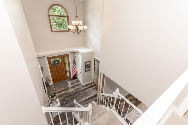 1608 Surrey St, Normal, IL 61761 - foyer entrance featuring a chandelier, a towering ceiling, stairway, and wood finished floors