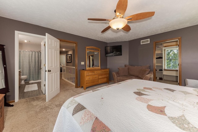 1608 Surrey St, Normal, IL 61761 - carpeted bedroom with a ceiling fan and ensuite bath