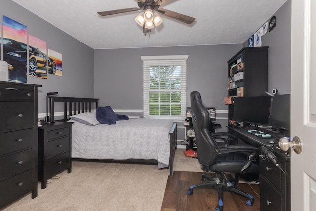 1608 Surrey St, Normal, IL 61761 - bedroom featuring a desk, wood finished floors, and a ceiling fan