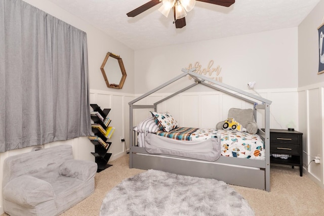 1608 Surrey St, Normal, IL 61761 - bedroom with carpet floors, a ceiling fan, a decorative wall, and wainscoting