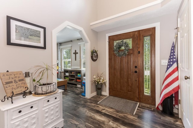 1608 Surrey St, Normal, IL 61761 - foyer with arched walkways and dark wood-style flooring