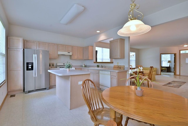 350 Woodhill Dr, Carol Stream, IL 60188 - kitchen with white appliances, light countertops, a kitchen island, light brown cabinets, and under cabinet range hood