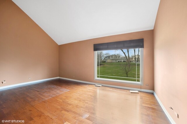 13 Chipping Campden Dr, South Barrington, IL 60010 - unfurnished room featuring vaulted ceiling and wood finished floors