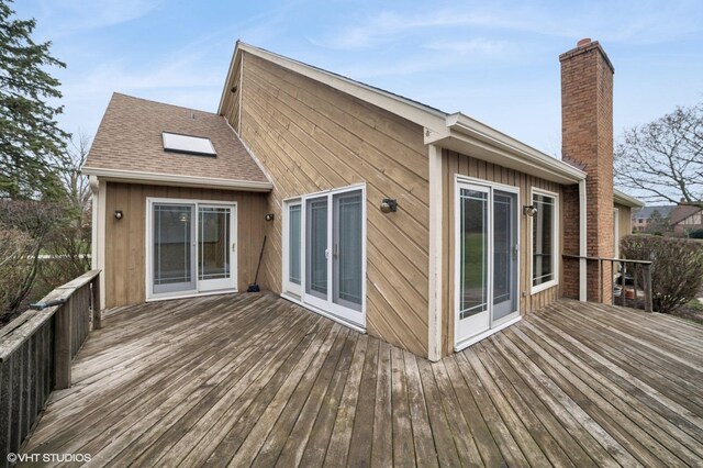 13 Chipping Campden Dr, South Barrington, IL 60010 - rear view of property featuring a chimney, a deck, and board and batten siding