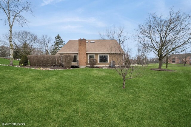 13 Chipping Campden Dr, South Barrington, IL 60010 - back of property featuring a yard and a chimney