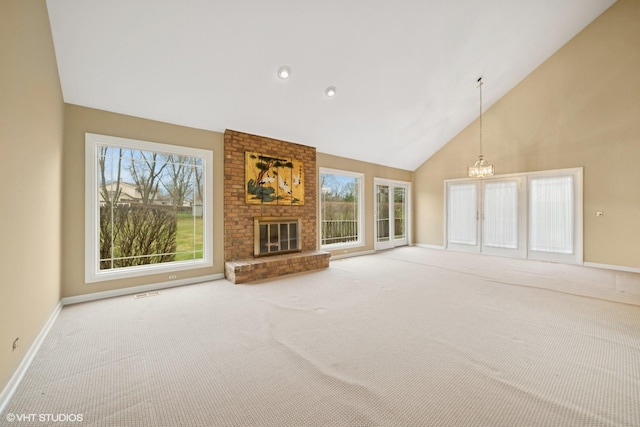 13 Chipping Campden Dr, South Barrington, IL 60010 - unfurnished living room with high vaulted ceiling, a chandelier, carpet flooring, a brick fireplace, and recessed lighting