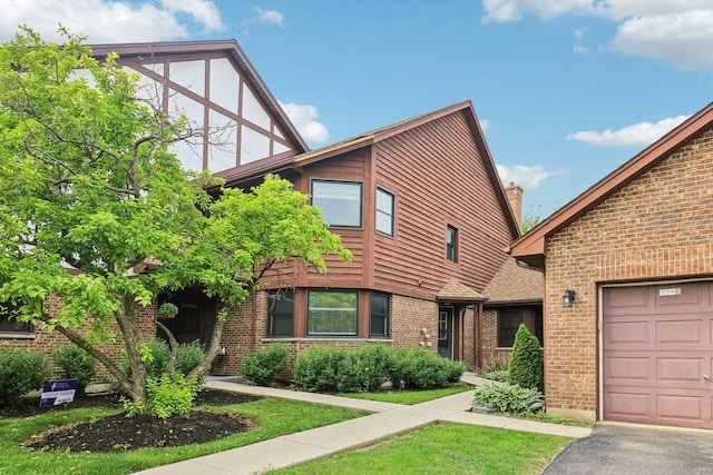 35 Terrace Ln Unit C, Lake Zurich, IL 60047 - tudor-style house featuring brick siding and an attached garage