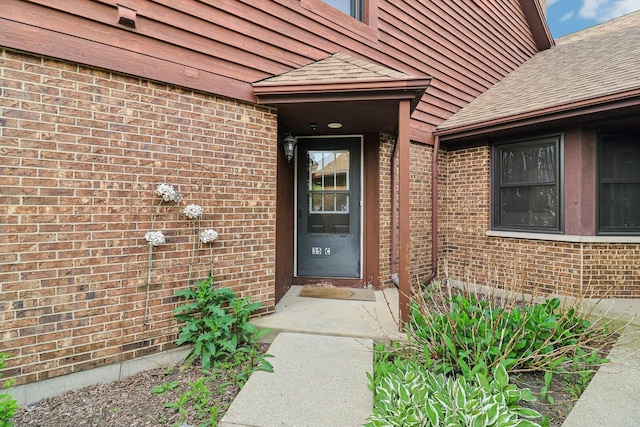 35 Terrace Ln Unit C, Lake Zurich, IL 60047 - doorway to property with brick siding and roof with shingles
