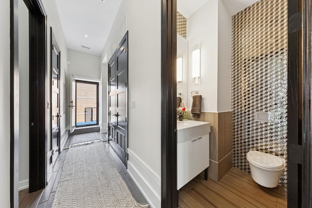 2756 N Magnolia Ave Unit Ph, Chicago, IL 60614 - hallway featuring light wood-type flooring and a wainscoted wall