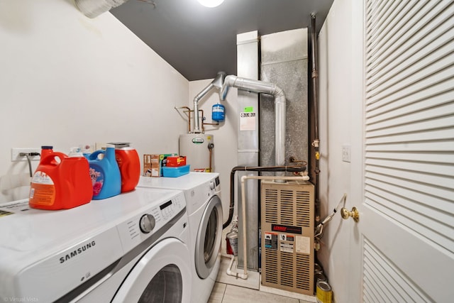 2026 Juniper Ct, Glendale Heights, IL 60139 - washroom featuring washing machine and dryer, water heater, and light tile patterned floors