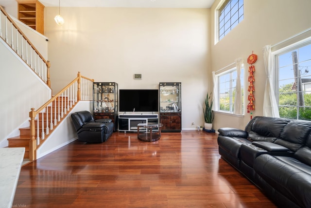 2026 Juniper Ct, Glendale Heights, IL 60139 - living room featuring stairs, plenty of natural light, wood finished floors, and a towering ceiling
