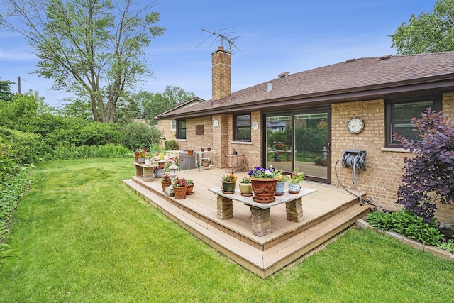 16524 Shirley Ct, South Holland, IL 60473 - back of house with a wooden deck, a lawn, a chimney, a shingled roof, and brick siding
