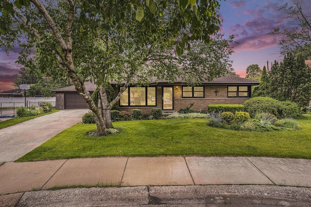 16524 Shirley Ct, South Holland, IL 60473 - view of front of house featuring driveway, brick siding, and a garage