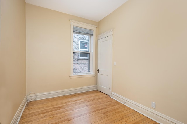 2115 N Sawyer Ave, Chicago, IL 60647 - spare room with light wood-style flooring and baseboards
