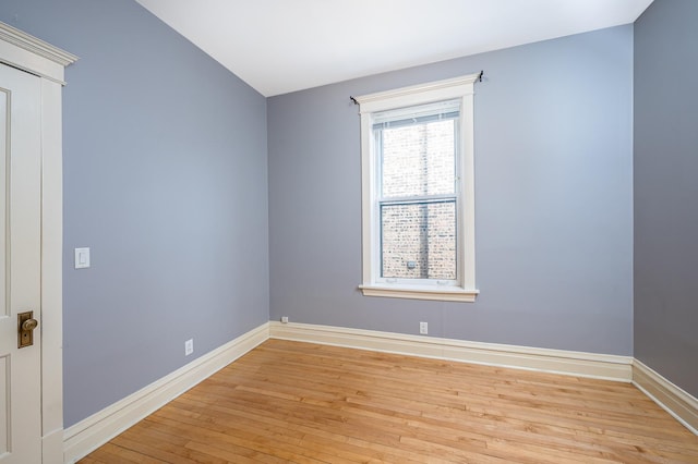 2115 N Sawyer Ave, Chicago, IL 60647 - spare room with light wood-style floors and baseboards