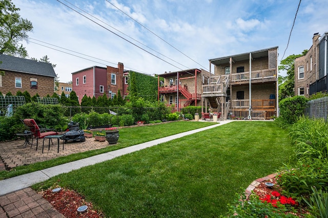 2115 N Sawyer Ave, Chicago, IL 60647 - view of property's community featuring an outdoor fire pit, a patio, and stairway