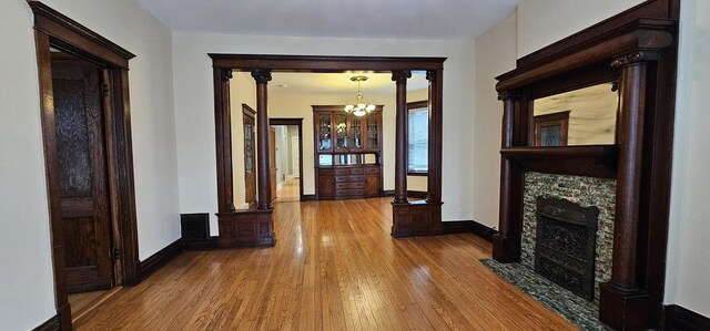 2115 N Sawyer Ave, Chicago, IL 60647 - corridor featuring hardwood / wood-style floors and a chandelier