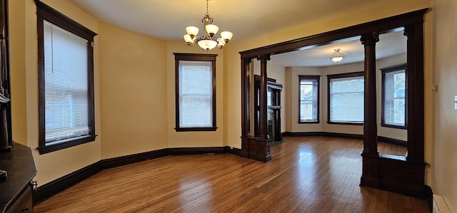 2115 N Sawyer Ave, Chicago, IL 60647 - unfurnished room with hardwood / wood-style floors and a chandelier