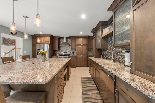 15431 Sulky Dr, Homer Glen, IL 60491 - kitchen with stainless steel appliances, wall chimney range hood, backsplash, light tile patterned flooring, and light stone countertops