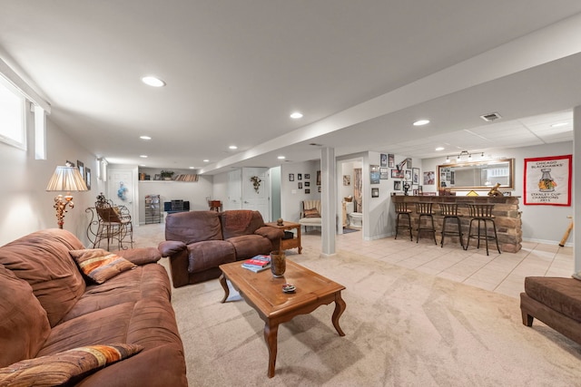 15431 Sulky Dr, Homer Glen, IL 60491 - tiled living room featuring bar area, recessed lighting, and carpet flooring