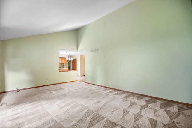 528 Carlson Ct, Batavia, IL 60510 - unfurnished room featuring carpet, a chandelier, and high vaulted ceiling