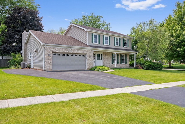 528 Carlson Ct, Batavia, IL 60510 - view of front of home featuring an attached garage, driveway, a front yard, a chimney, and brick siding