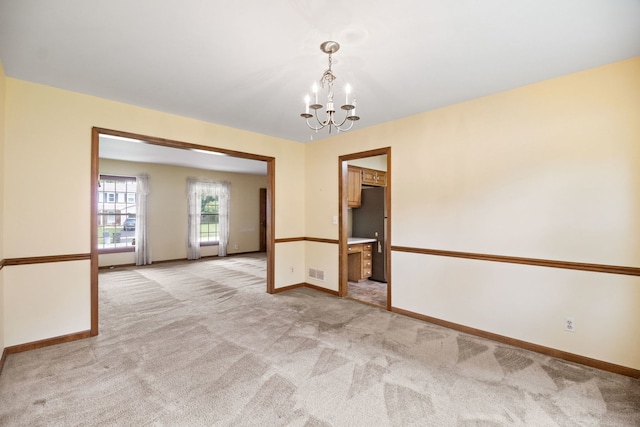 528 Carlson Ct, Batavia, IL 60510 - unfurnished room with a chandelier and light carpet