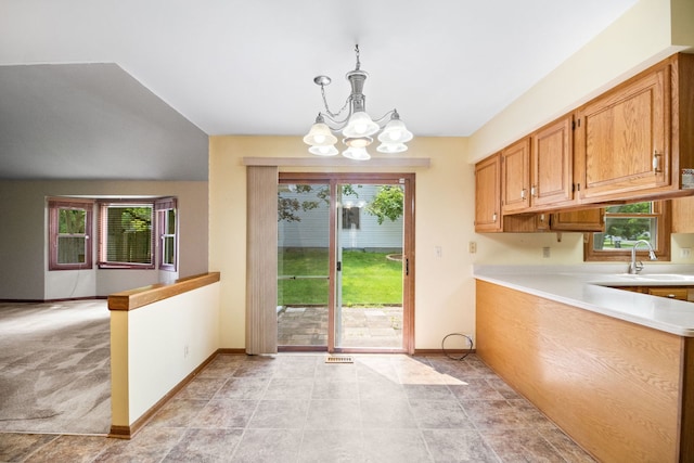 528 Carlson Ct, Batavia, IL 60510 - kitchen featuring a chandelier, light countertops, and hanging light fixtures