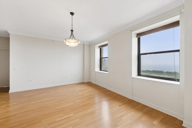 310 S Michigan Ave Unit 1804, Chicago, IL 60604 - unfurnished room featuring healthy amount of natural light, light wood-style flooring, and crown molding