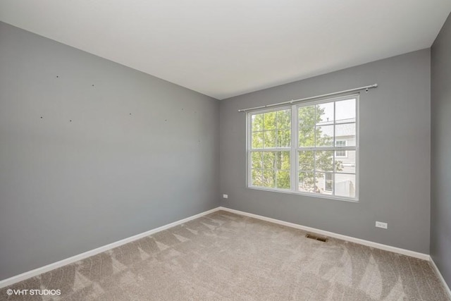 2733 Kendall Xing, Johnsburg, IL 60051 - spare room with baseboards and light colored carpet
