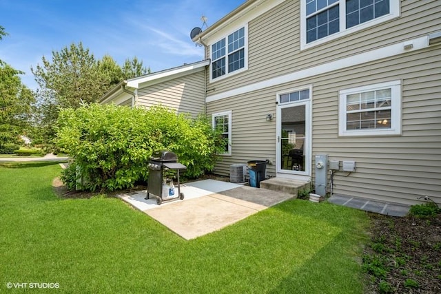 2733 Kendall Xing, Johnsburg, IL 60051 - rear view of house with a patio area and a lawn
