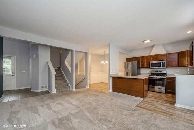 2733 Kendall Xing, Johnsburg, IL 60051 - kitchen with appliances with stainless steel finishes, light colored carpet, light countertops, open floor plan, and recessed lighting
