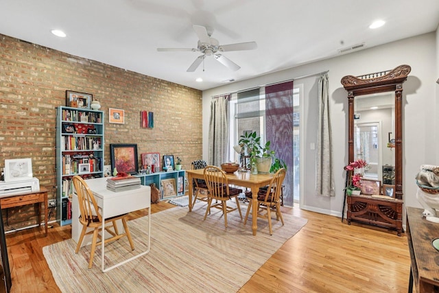 1639 W Farwell Ave Unit 1, Chicago, IL 60626 - dining area with brick wall, a ceiling fan, wood finished floors, and recessed lighting
