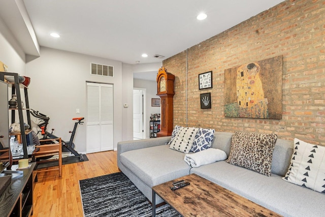 1639 W Farwell Ave Unit 1, Chicago, IL 60626 - living area with wood finished floors, brick wall, and recessed lighting