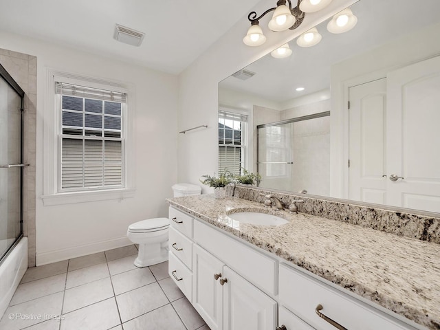 551 W 3rd St, Elmhurst, IL 60126 - bathroom with tile patterned floors, vanity, and combined bath / shower with glass door