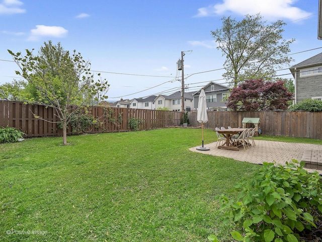 551 W 3rd St, Elmhurst, IL 60126 - fenced backyard featuring a patio and a residential view