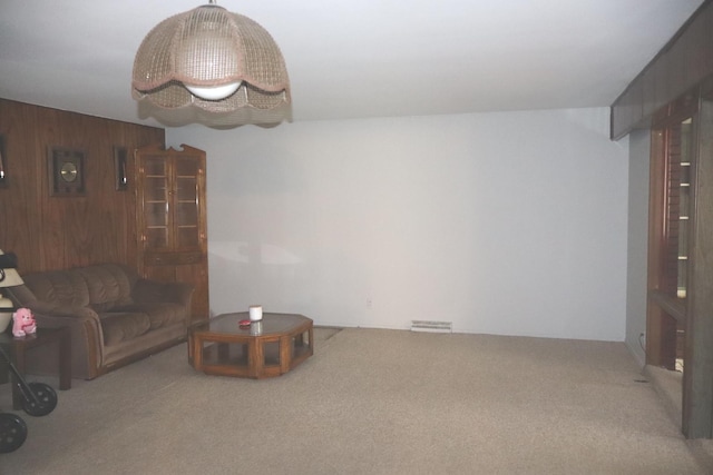 15153 Harding Ave, Midlothian, IL 60445 - living room featuring carpet floors and wood walls