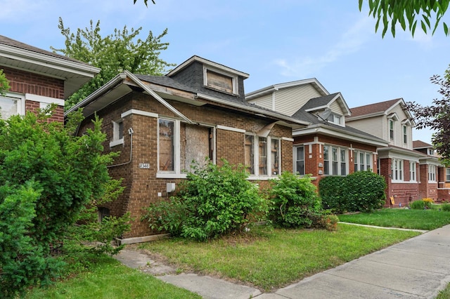 8348 S Oglesby Ave, Chicago, IL 60617 - view of front of house with brick siding and a front lawn