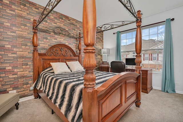 8808 Concord Ln Unit J, Justice, IL 60458 - bedroom with light colored carpet, a towering ceiling, a desk, and brick wall