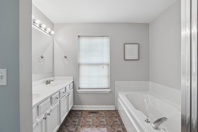 11176 Fleetwood St, Huntley, IL 60142 - bathroom with double vanity and a garden tub