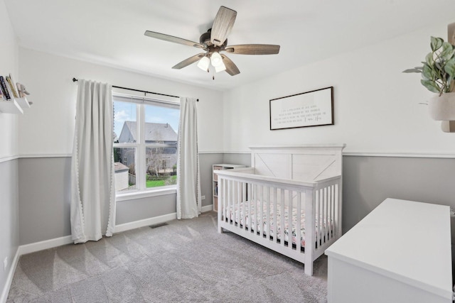 11176 Fleetwood St, Huntley, IL 60142 - carpeted bedroom featuring a crib and a ceiling fan