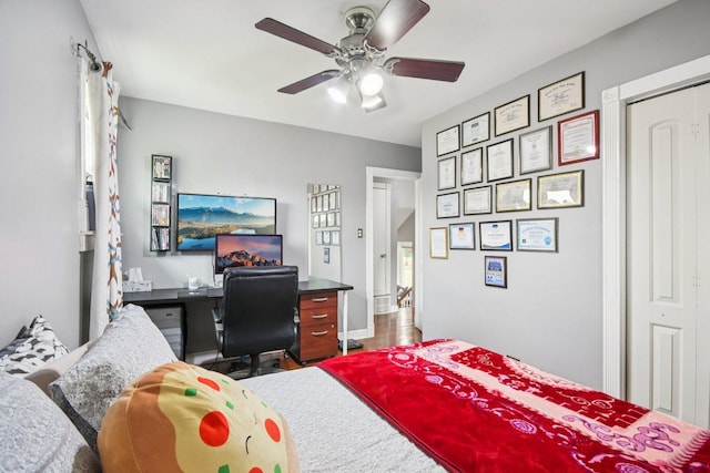 9342 Oriole Ave, Morton Grove, IL 60053 - bedroom featuring a desk, wood finished floors, a ceiling fan, and a closet