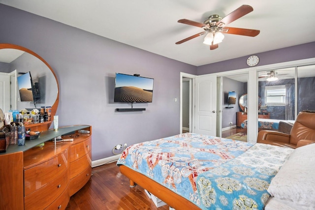 9342 Oriole Ave, Morton Grove, IL 60053 - bedroom with dark wood-style floors, two closets, and ceiling fan