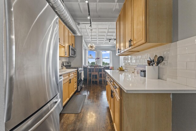 1307 S Wabash Ave Unit 413, Chicago, IL 60605 - kitchen featuring stainless steel appliances, dark wood-style floors, light countertops, and tasteful backsplash